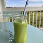 A Glass Jar With Green Smoothie