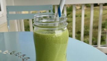 A Glass Jar With Green Smoothie